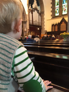 services-children-pew-child Child sat on a pew during the service at St Michael's Church
