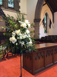 services-funerals-memorials-chancel-flowers White funeral flowers on the alter at St Michael's Church